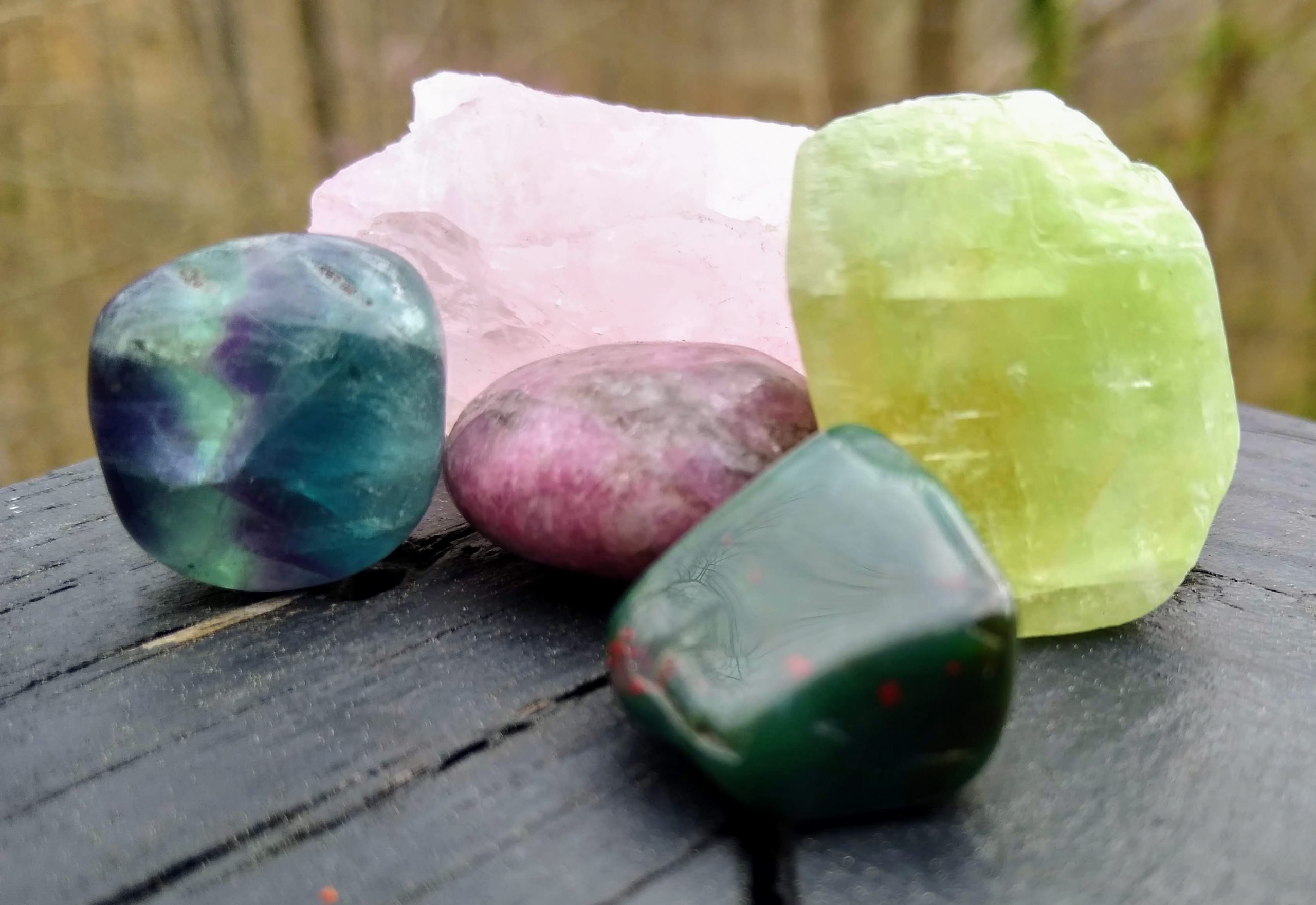 5 recommended crystals for quarantine - rose quartz, lepidolite, green calcite, bloodstone, fluorite